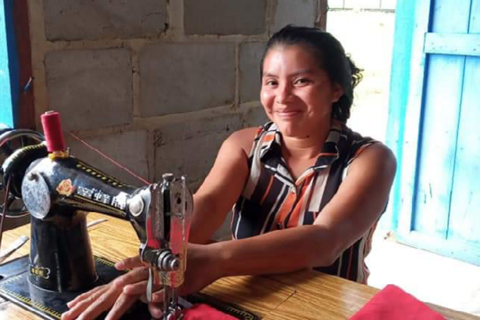 Anita Williams, chairperson of the Shea Village Women’s group, sewing masks. They did the job voluntarily.