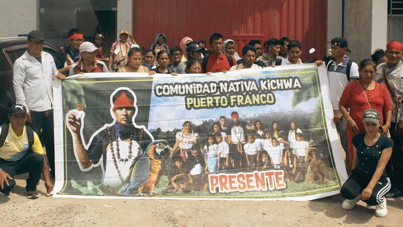 Group of people holding a banner